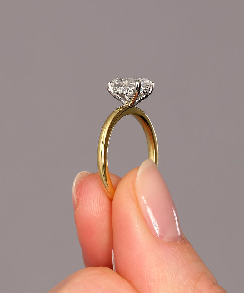 1.50ct oval cut lab grown diamond hidden halo solitaire engagement ring with platinum head by Layla Diamonds.