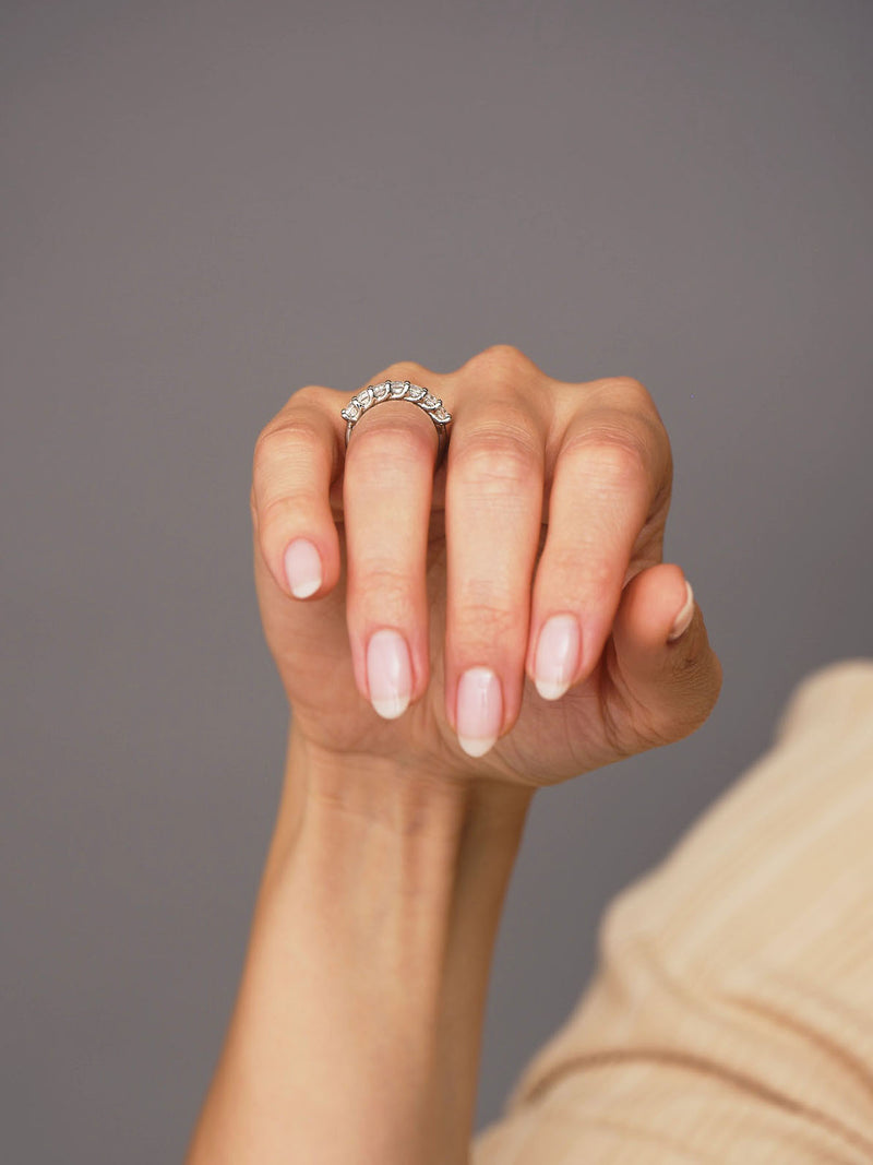 Close-up detail of the brilliant large-scale oval cut diamonds on this luxury engagement rings for women style.