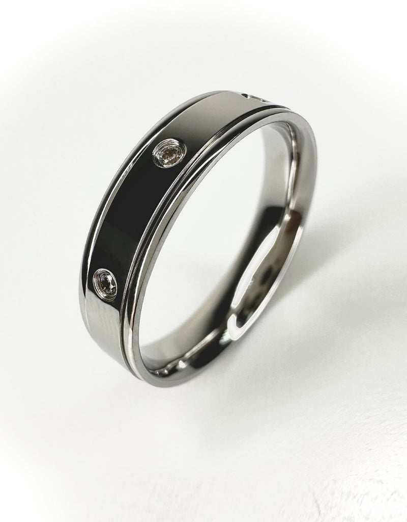 A contemporary diamond set 5mm flat track edge ring from our exclusive wedding band for him collection.